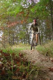 An off road biker negotiates a turn